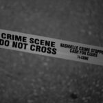 Grayscale Photo of Crime Scene Do Not Cross Tape